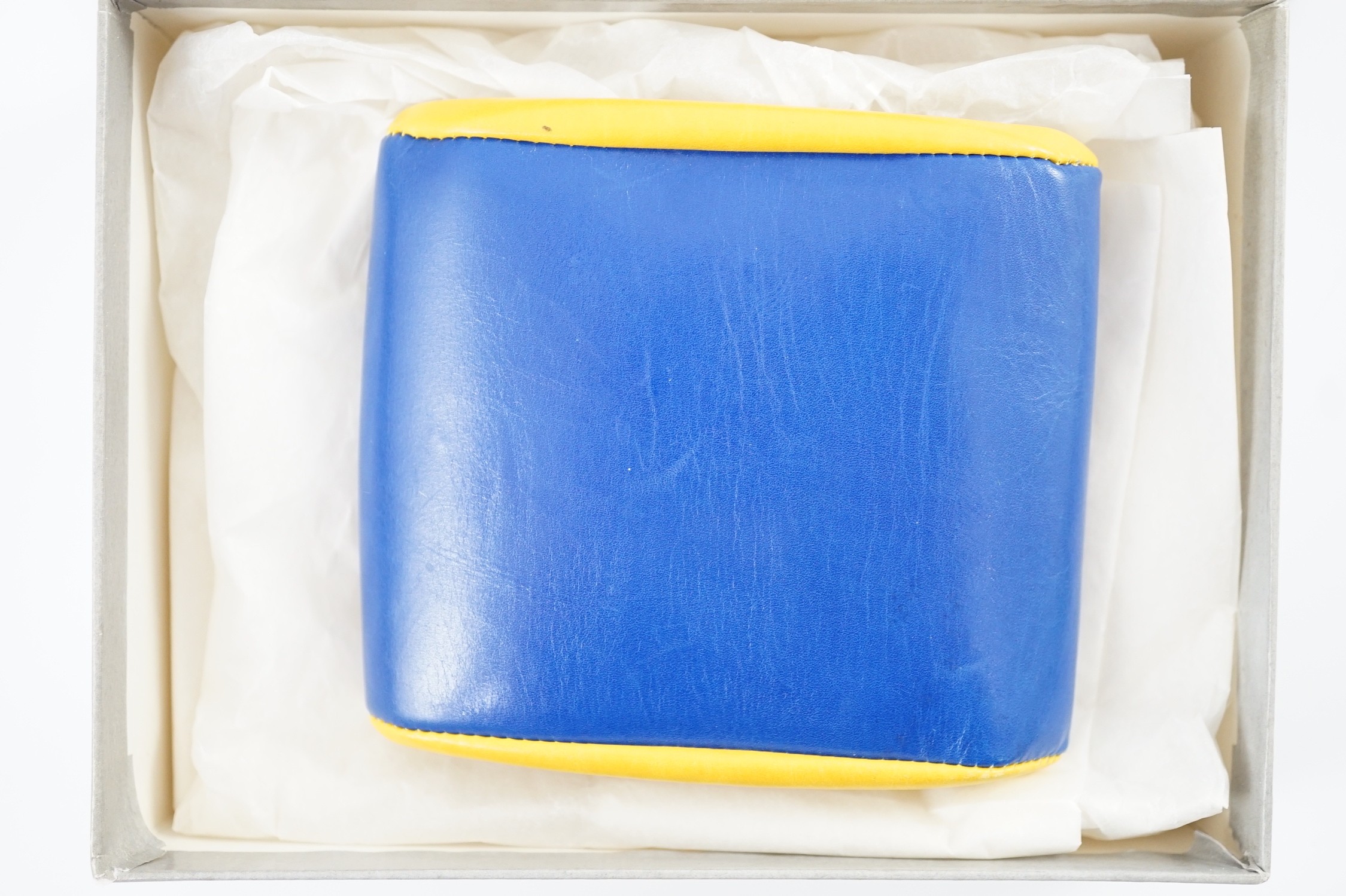 A boxed Gucci yellow and blue leather purse, 9 cm.